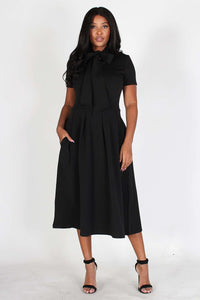 Solid, midi dress in a fit and flare style with a necktie